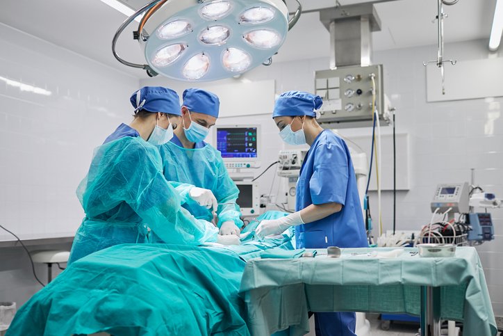 team of surgeons in operating room at a hospital.